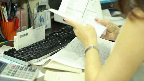 Secretary going through documents in Cali, Colombia Stock Footage 92499775