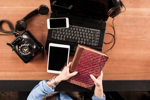 The secretary keeps the book instead of working, view from above Stock Photos