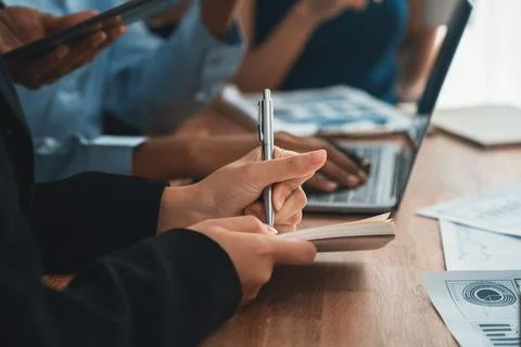 Secretary taking notes on notebook at corporate meeting. Concord Stock Photos