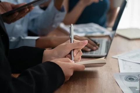 Secretary taking notes on notebook at corporate meeting. Concord Stock Photos