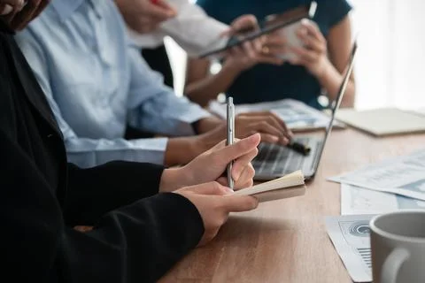 Secretary taking notes on notebook at corporate meeting. Concord Stock Photos