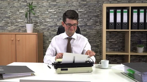 Secretary is typing at a table with a cup of coffee in the workplace Stock Footage 116417529