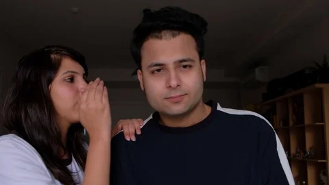 Secrets between a young beautiful Indian husband and wife while looking towards  Stock Footage 100631909