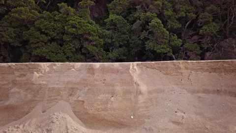 A section of beach washed away by the tide, New Zealand Video stock 132705421