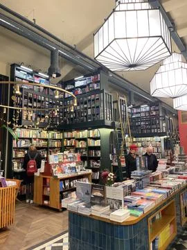 Section of the bookstore with customers. Stock Photos