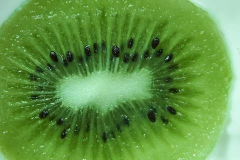 Section of cut ripe kiwifruit Stock Photos