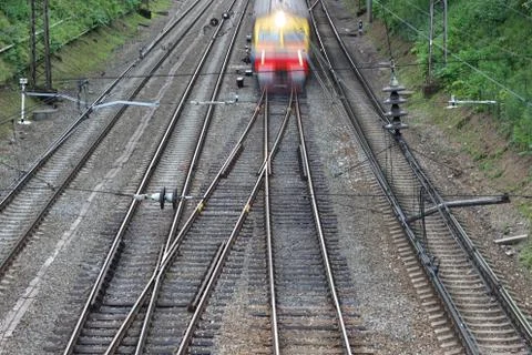 A section of an electrified railway with four paths and a transition Stock Photos