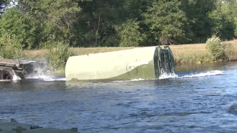 A section of floating bridge slides into water from Common Bridge Transporter Stock Footage 289628466