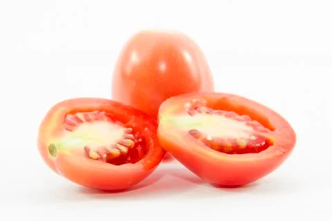 Section half sliced tomatoes with raw material Stock Photos