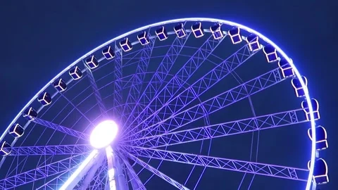 Section of large Ferris wheel illuminated at night, Dusseldorf Stock Footage 303491644