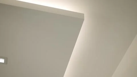 Section of modern minimalist ceiling with indirect lighting. Ceiling clean lines Stock Footage 295551021