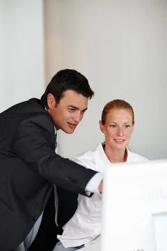 This section needs some adjustments...A helpful businessman aiding a colleague Stock Photos