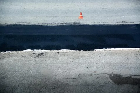 Section of road with a recently paved. Black row of asphalt on background to Stock Photos