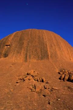 A section of the rock formation of Uluru (Ayers Rock) at sunrise Stock Photos