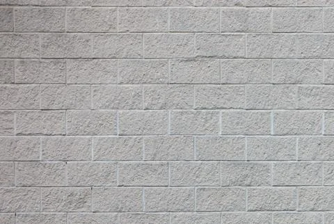 Section of rough textured block wall background Stock Photos