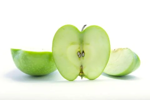 Section sliced green apple and quarter with seed Stock Photos