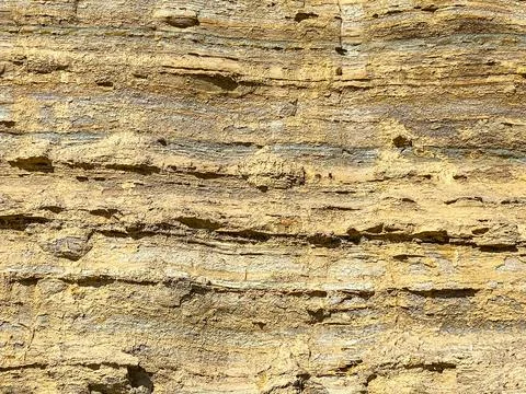 A section of soil with layers of different colors on it Stock Photos