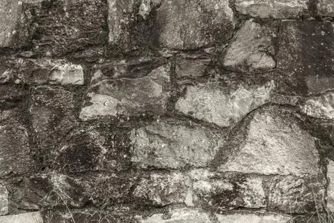 A section of a stone wall in black and white 스톡 사진