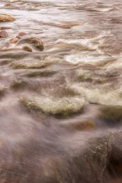 A section of the stream and rocks of the El Valle river, long exposure photog Stock Photos