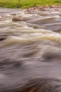 A section of the stream and rocks of the El Valle river, long exposure photog Stock Photos