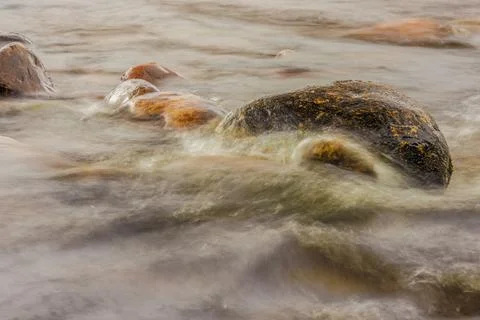 A section of the stream and rocks of the El Valle river, long exposure photog Stock Photos
