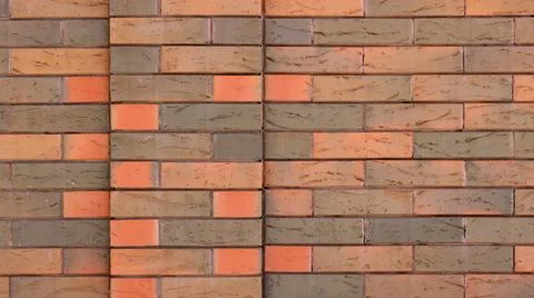A section of variegated brickwork in various shades. Stock Photos
