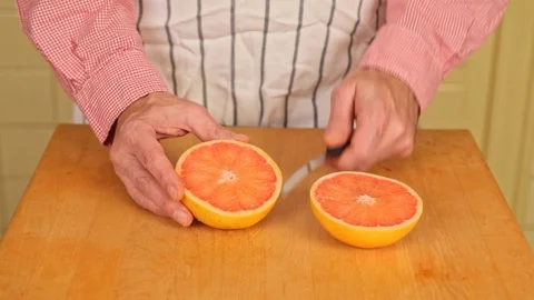 Sectioning a Grapefruit Stock-Footage 126655279