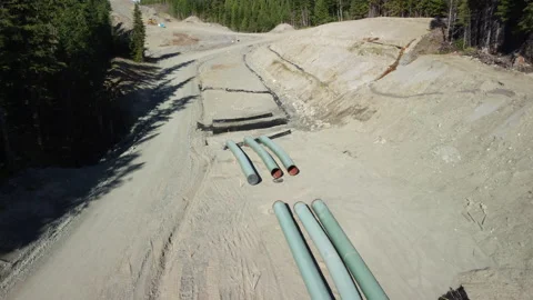 Sections of pipe awaiting welding on a pipeline Stock Footage 163182150