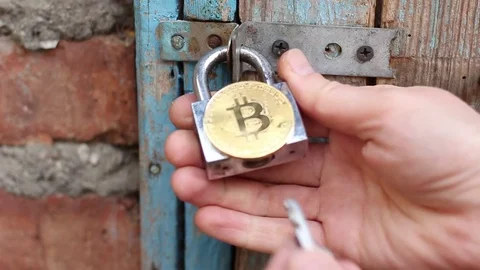 Secure Bitcoin storage. The lock opens Stock Footage 83066129