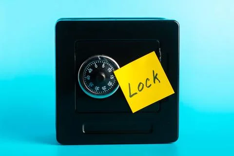 Secure box with combination lock and sticky note reminder Stock Photos