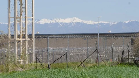 Secure building with razor wire and fences. Stock Footage 107414719