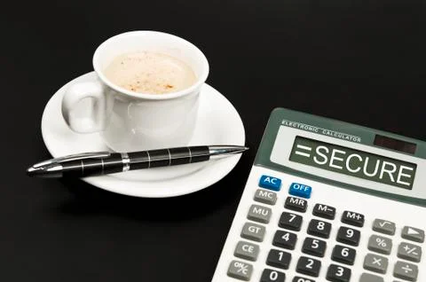 Secure on calculator Stock Photos