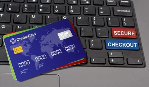 Secure Checkout written on keyboard keys with credit cards Stock Photos