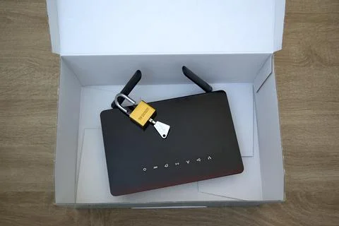 Secure hardware storage concept with router and padlock Stock Photos