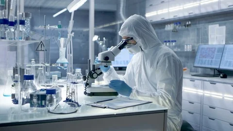 In a Secure High Level Research Laboratory Scientist in a Coverall. Video stock 75477446