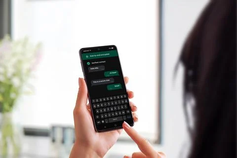 Secure messaging app on smartphone with end-to-end encryption and verified .. Stock Photos