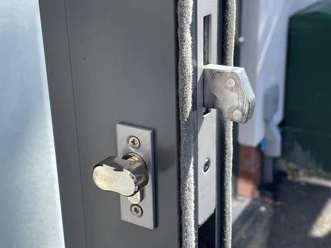 Secure modern chrome door lock with lock mechanism and thumb turn lock Stock Photos