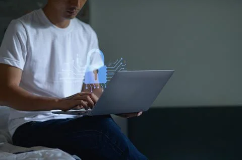 Secure Network Hologram Displayed Above Laptop in Modern Setting 写真素材
