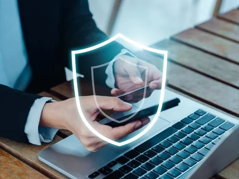 Secure payment concept. The large shield icon glowing while business people.. Stockfoto's