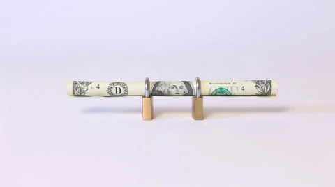Secured dollar bill rolled into padlock on isolated white background Stock Footage 59539143