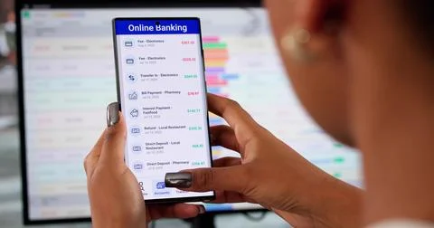 Securely Transferring Money Using Mobile Banking App For Account Balance. Stock Photos