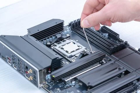 Securing cpu in motherboard socket with retention bracket, detailed compute.. 写真素材