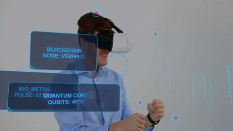 Securing headset, man activating HUD, gesturing, verifying blockchain and Stock Footage 333004444