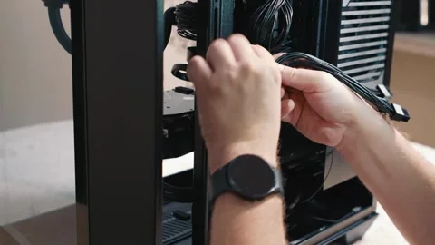 Securing power cables with zip ties inside computer case Stockbeeldmateriaal 340881953