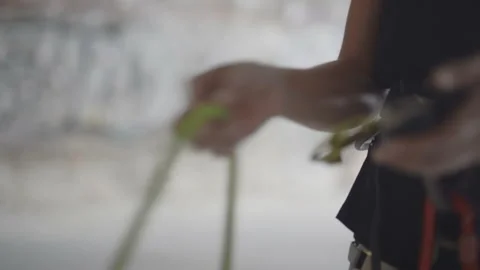 Securing quickdraw tension grip rock climbing closeup Stock Footage 142854083