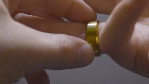 Securing a ring solidly onto the finger. Stock Footage 346645251