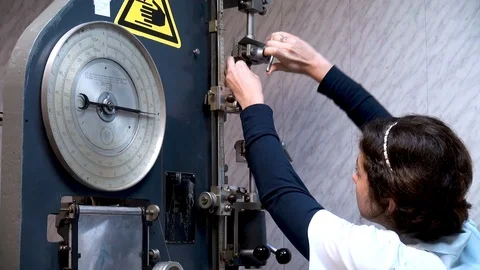 Securing rubber specimen in tensile machine. Tensile rubber analysis. Stock Footage 108700406
