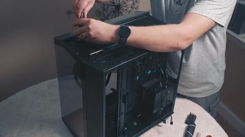 Securing top ventilation panel of computer case with screws Stock Footage 335069196