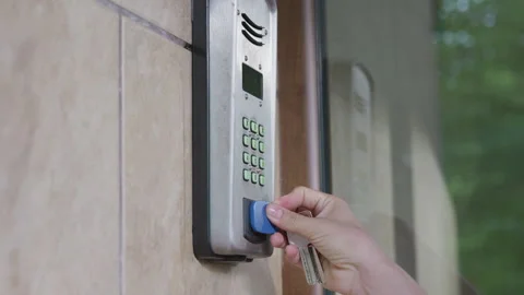Security access control panel mounted on wall, showing keypad and display, as a Stock Footage 340275031