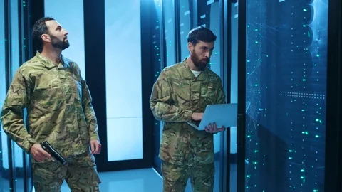 Security alarm in database. Two armed dangerous military men on spy mission Stock Footage 121270705